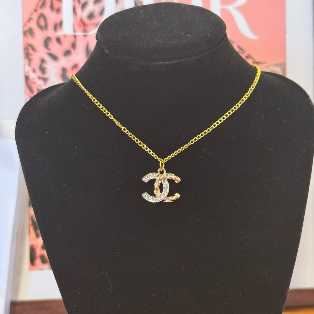 Chanel charm (authentic) on unbranded necklace
